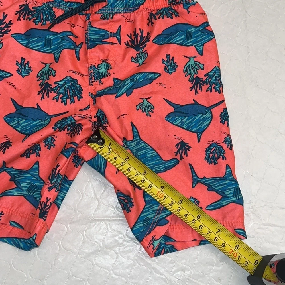 Old Navy coral and teal shark print lined swim trunks